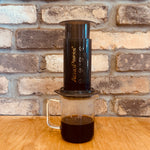 AeroPress coffee brewing method showing smooth, balanced extraction