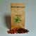 Bag of Espresso Corazón coffee with chocolate and nutty flavour props beside it