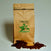 Bag of Millionaire’s Mixture dark roast coffee with chocolate and roasted nut flavour props arranged beside it